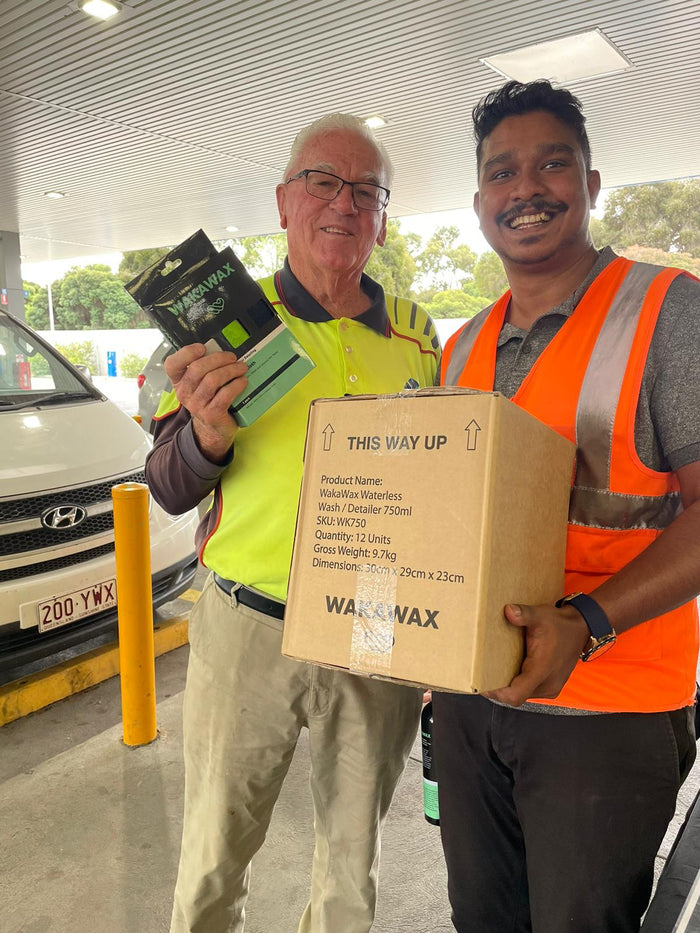 Happy customer holding a WakaWax product