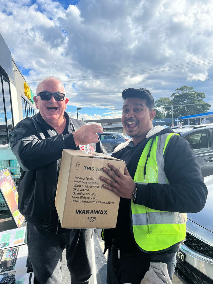 WakaWax customer standing beside their vehicle